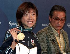 Marathon winner Takahashi shows off her gold medal